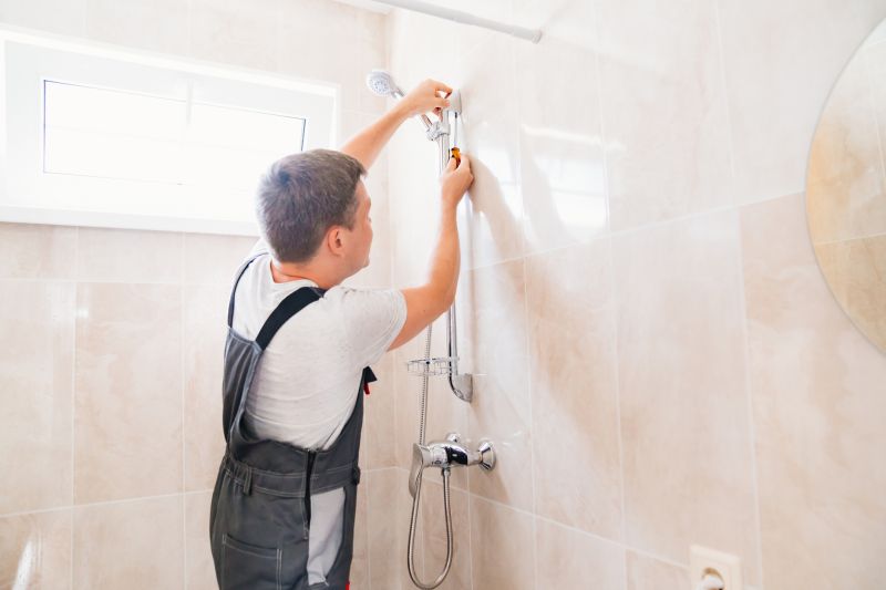 Plumber Installing Shower Fixtures